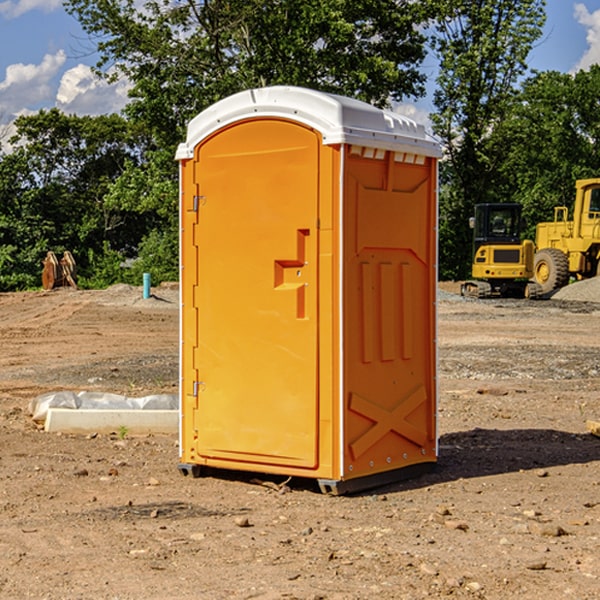 what is the cost difference between standard and deluxe portable restroom rentals in Bonham